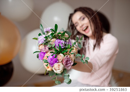 Smiling woman with dreadlocks hairstyle. 39251863