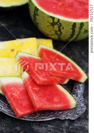 Slices of red and yellow watermelon 39252527
