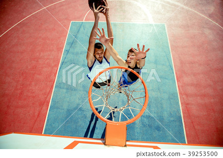 High angle view of basketball player dunking 39253500
