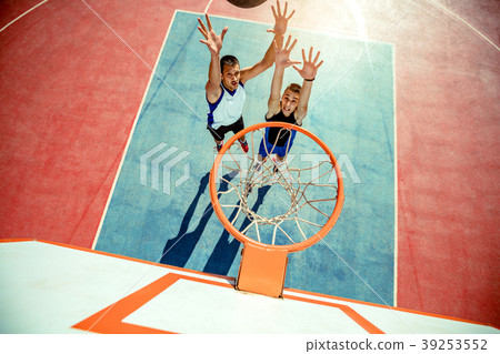 High angle view of basketball player dunking 39253552