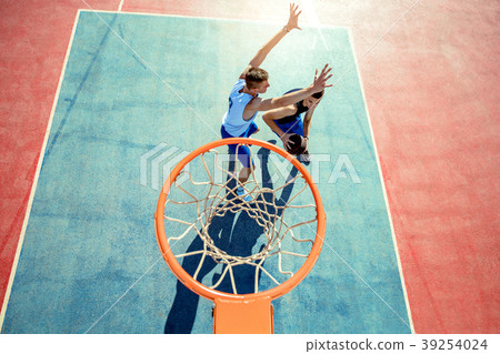 High angle view of basketball player dunking 39254024