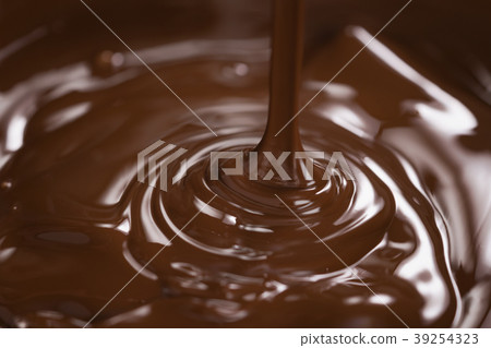 melting dark chocolate in steel bowl melting dark chocolate in steel bowl 39254323