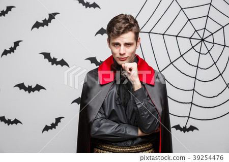 Vampire Halloween Concept - Portrait of handsome Vampire Halloween Concept - Portrait of handsome 39254476