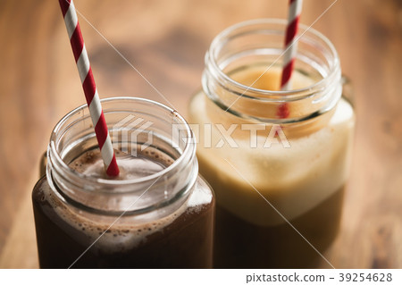 warm cocoa and coffee in jar mugs on a wooden warm cocoa and coffee in jar mugs on a wooden 39254628