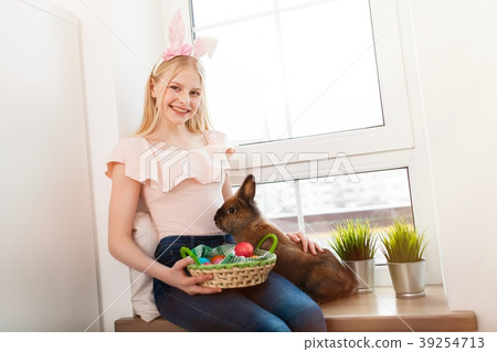 Teenage girl holding Easter eggs 39254713