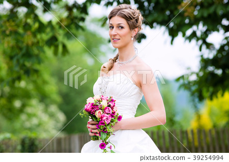 Bride in wedding dress with bridal bouquet 39254994
