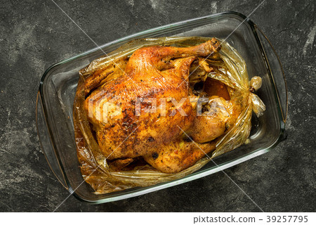 baked whole chicken with spices in a baking bag 39257795