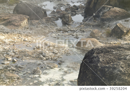 Streams of hot water flow through rocks. Streams of hot water flow through rocks. 39258204