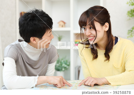 Parent and child planning a trip 39258878