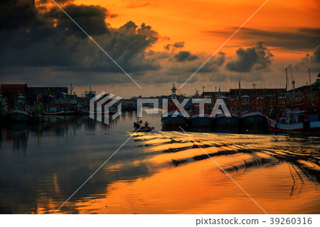 boat sailing through Rayong port at sunrise boat sailing through Rayong port at sunrise 39260316