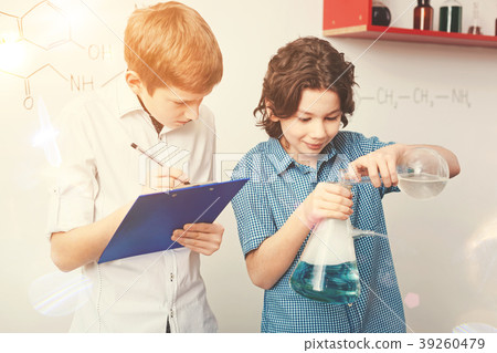 Serious blonde teenager making notes 39260479