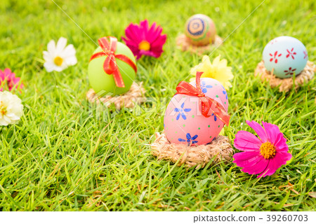 Closeup Colorful Easter eggs in nest Closeup Colorful Easter eggs in nest 39260703