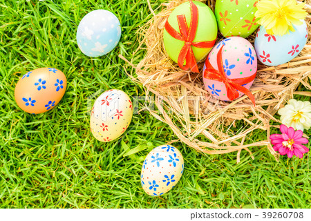 Closeup Colorful Easter eggs on green grass field 39260708