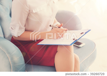 Close up of office lady that filling in the form Close up of office lady that filling in the form 39260720