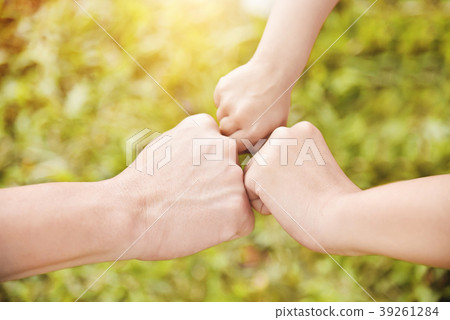 Family join hands together. Family join hands together. 39261284