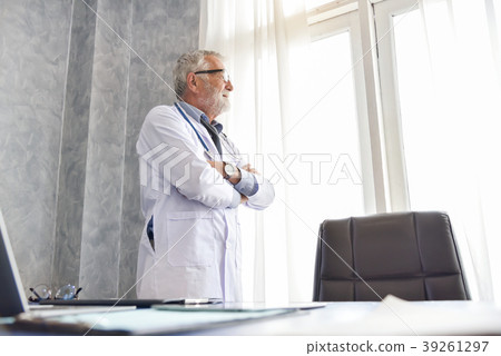 Senior male Doctor is thinking. Senior male Doctor is thinking. 39261297