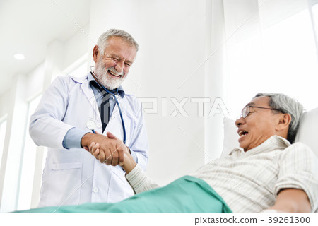 Senior male Doctor is talking with Asian male patient. Senior male Doctor is talking with Asian male patient. 39261300
