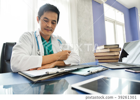 Asian male doctor is working. Asian male doctor is working. 39261301