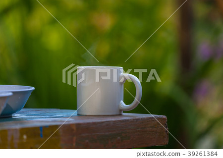 hot coffee on wooden table 39261384