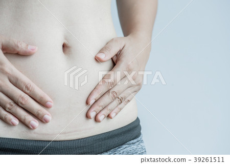 Closeup of woman showing on her belly dark scar  39261511