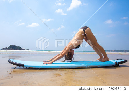 A girl is practicing yoga A girl is practicing yoga 39262440