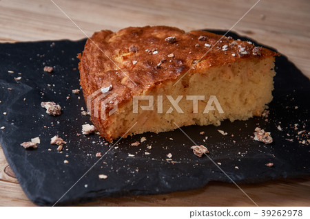 Delicious fresh baked piece of apple pie on shale Delicious fresh baked piece of apple pie on shale 39262978