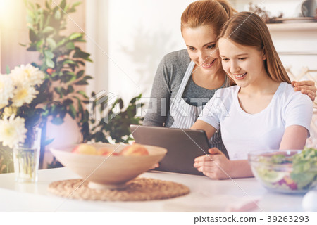 Kind female person embracing her daughter Kind female person embracing her daughter 39263293