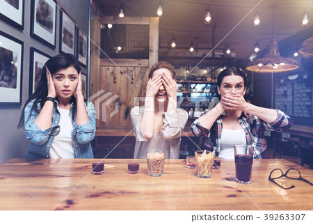 Delighted positive women playing a game Delighted positive women playing a game 39263307