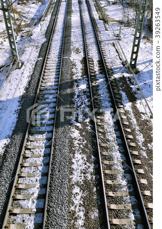Railway mound with rails going into the distance. Railway mound with rails going into the distance. 39263549