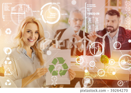 Young cheerful woman smiling and holding a 39264270