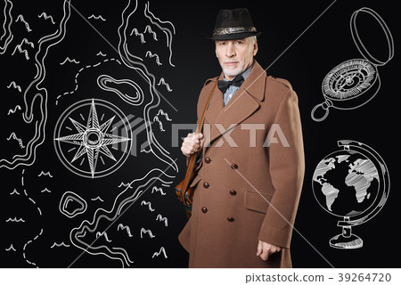 Calm man in brown coat looking confident before Calm man in brown coat looking confident before 39264720