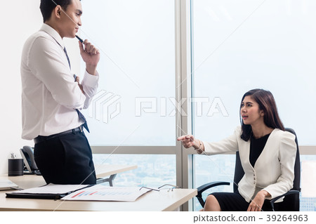Co-workers in office having conversation Co-workers in office having conversation 39264963