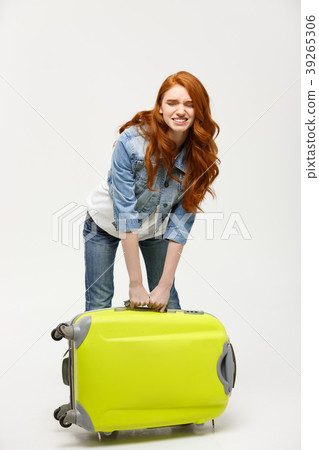 Travel and Lifestyle Concept: Young woman suffers Travel and Lifestyle Concept: Young woman suffers 39265306