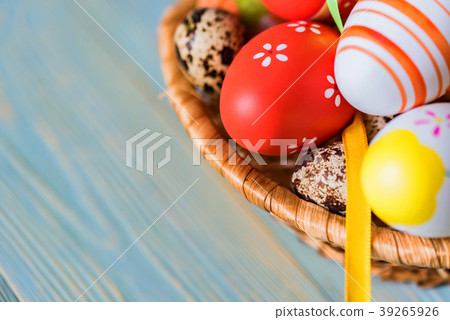 Several colorful Easter eggs in basket close 39265926
