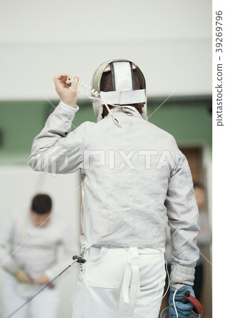 Back of young fencer in white costume and Back of young fencer in white costume and 39269796