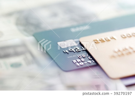 Credit cards on a banknotes background Credit cards on a banknotes background 39270197