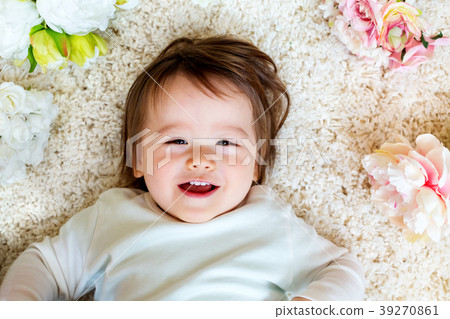 Happy toddler boy with spring flowers Happy toddler boy with spring flowers 39270861