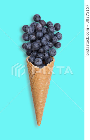 Blueberry ice cream cone with fresh fruits Blueberry ice cream cone with fresh fruits 39275157