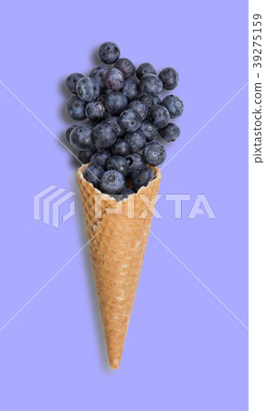 Blueberry ice cream cone with fresh fruits 39275159