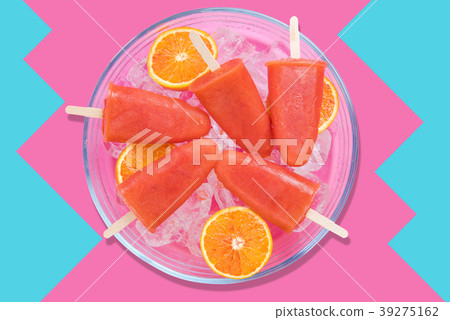Colorful orange popsicles with ice. Colorful orange popsicles with ice. 39275162