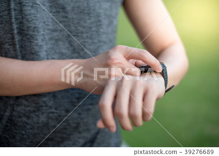 Male hand using smart watch for running Male hand using smart watch for running 39276689