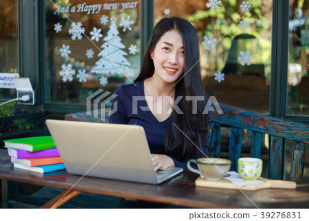 woman working with laptop in the cafe woman working with laptop in the cafe 39276831