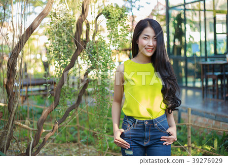 portrait of beautiful asian woman in garden portrait of beautiful asian woman in garden 39276929
