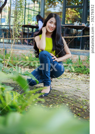 portrait of beautiful asian woman in garden portrait of beautiful asian woman in garden 39276932