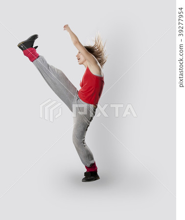 Teenage girl dancing breakdance in action Teenage girl dancing breakdance in action 39277954