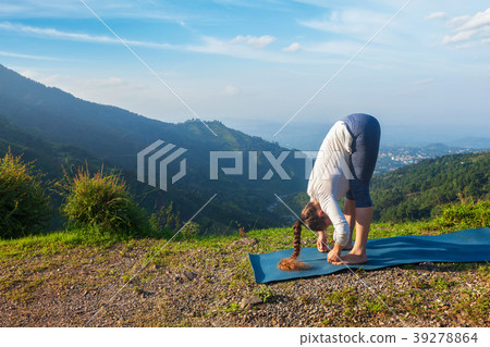 Woman doing yoga Sun salutation Surya Namaskar 39278864