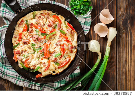 Fresh omelette with bacon and bell pepper 39278897
