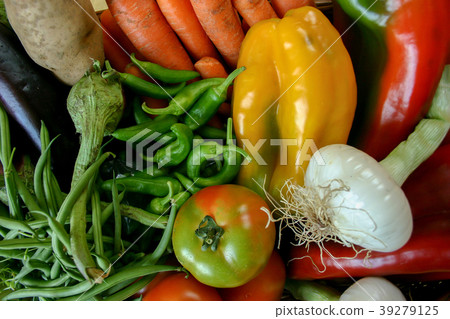 Fresh vegetables in the foreground Fresh vegetables in the foreground 39279125