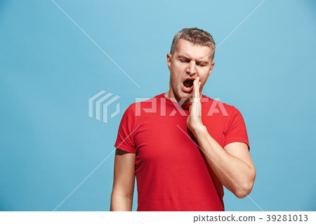 Beautiful bored man bored isolated on blue Beautiful bored man bored isolated on blue 39281013