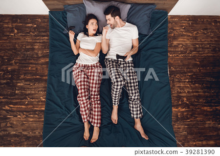 Top view handsome man and woman in bed. Top view handsome man and woman in bed. 39281390